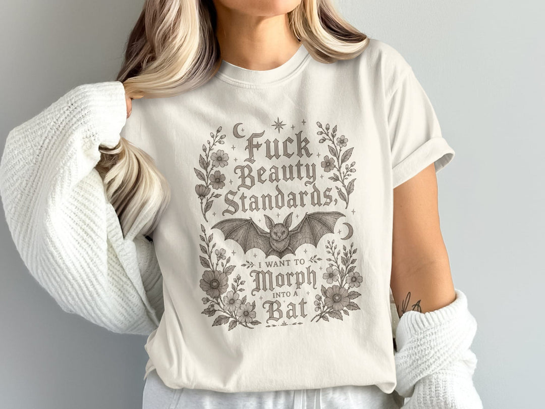 T-shirt with "Fuck Beauty Standards, I Want to Morph Into a Bat" text and a bat.