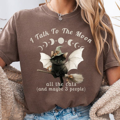 Brown t-shirt with cat wearing witch hat on broom, "I Talk To The Moon" text.