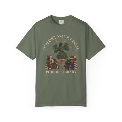 Support your local public library graphic on a green t-shirt.