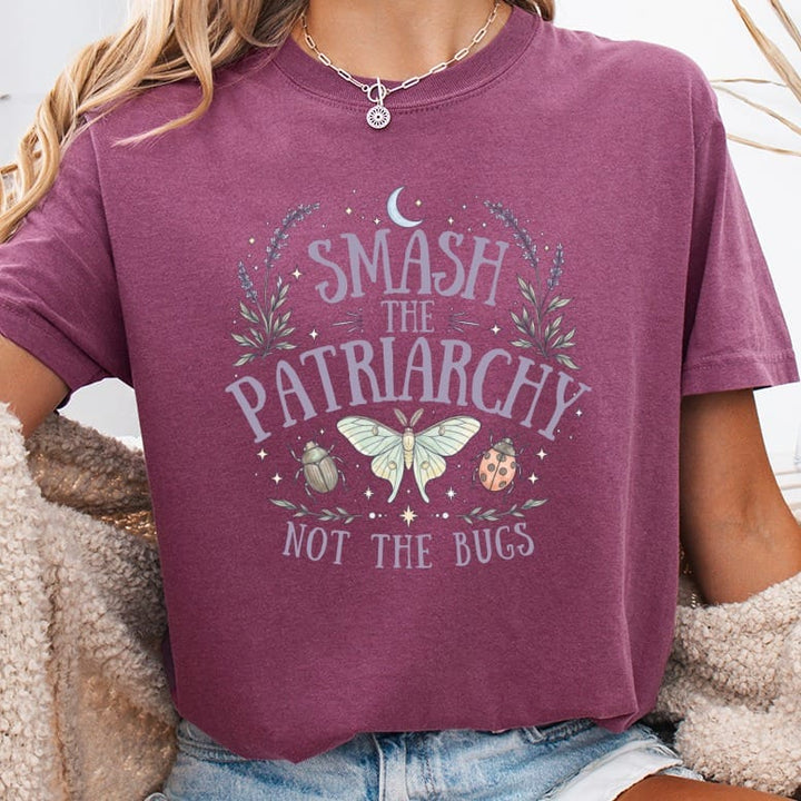 Maroon t-shirt with "Smash the Patriarchy Not the Bugs" text and celestial bug graphic.