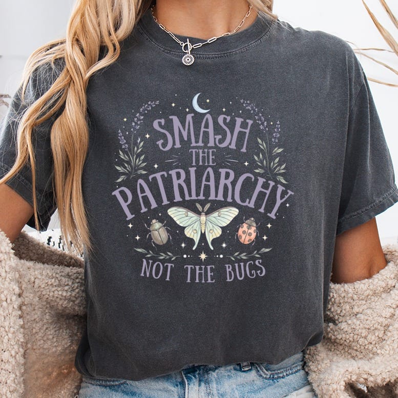 Dark t-shirt with "Smash the Patriarchy Not the Bugs" text and moths.