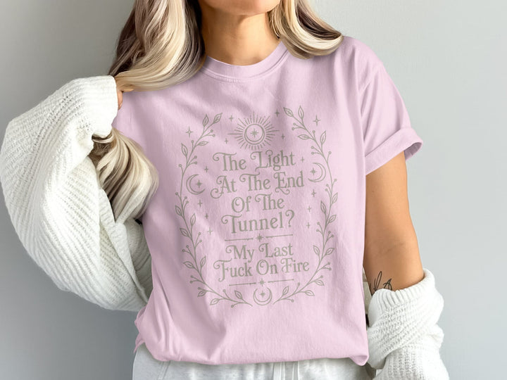 Pink t-shirt with "The Light At The End Of The Tunnel? My Last Fuck On Fire" text.