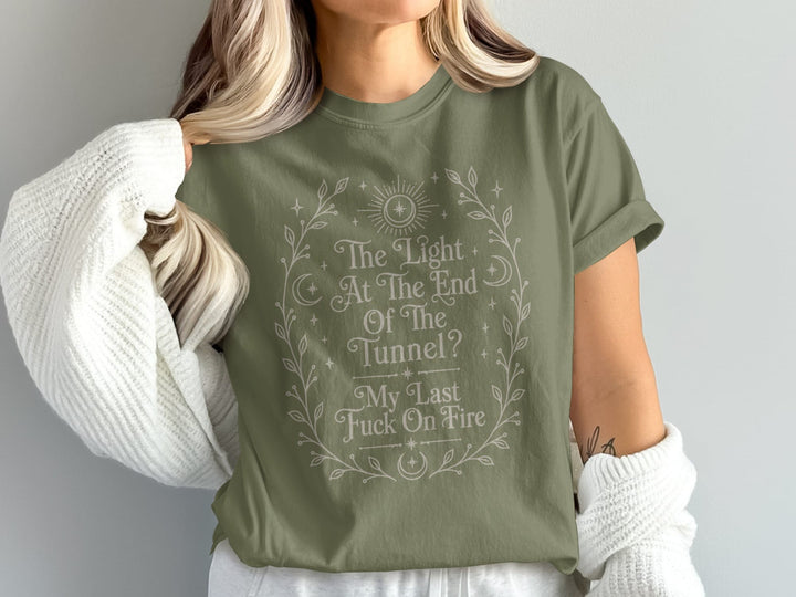 Green t-shirt with text "The Light At The End Of The Tunnel? My Last Fuck On Fire."
