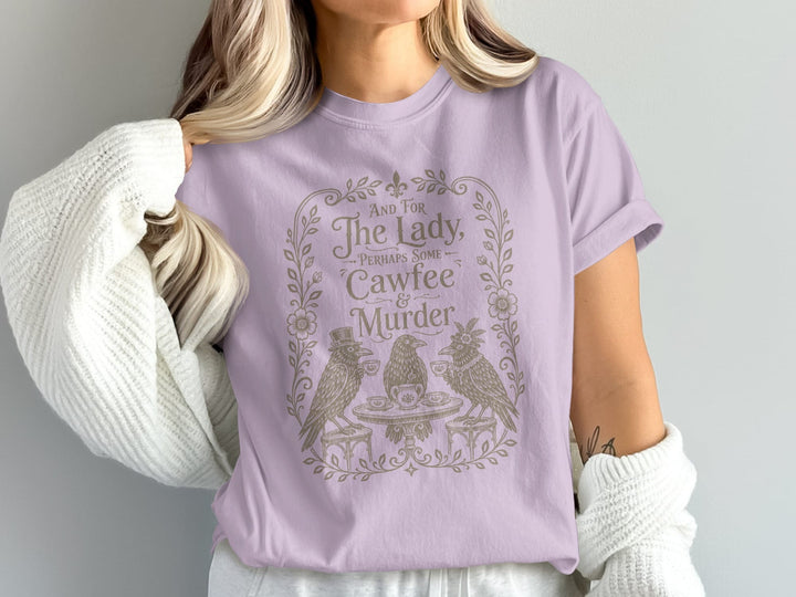 Lavender t-shirt with "And for The Lady, Perhaps some Cawfee & Murder" and crow illustration.