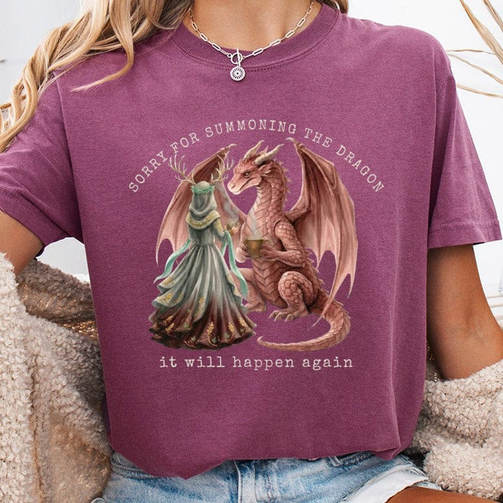 T-shirt with dragon and woman holding goblet, text "Sorry for summoning the dragon, it will happen again."