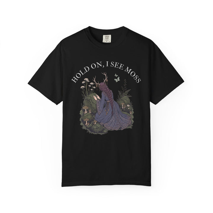 Black t-shirt with art of a woman with antlers, text "HOLD ON, I SEE MOSS".