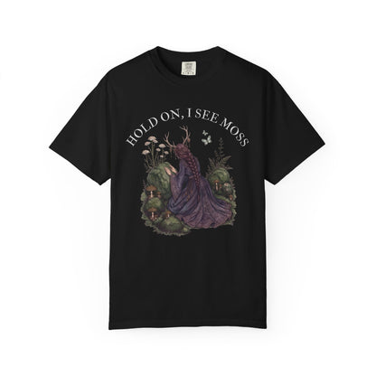 Black t-shirt with a mystical illustration of a woman with antlers and moss.