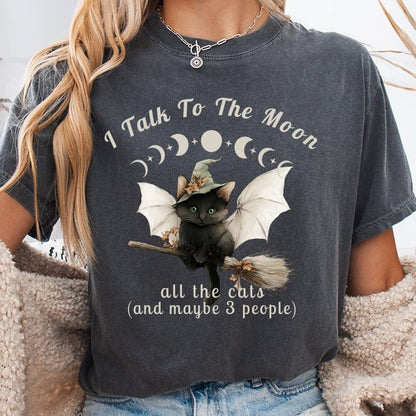 Black cat in witch hat with wings on broom, text "I Talk To The Moon, all the cats".