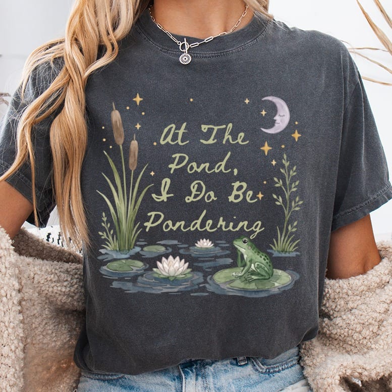 Dark grey t-shirt with "At The Pond, I Do Be Pondering" and a pond scene.