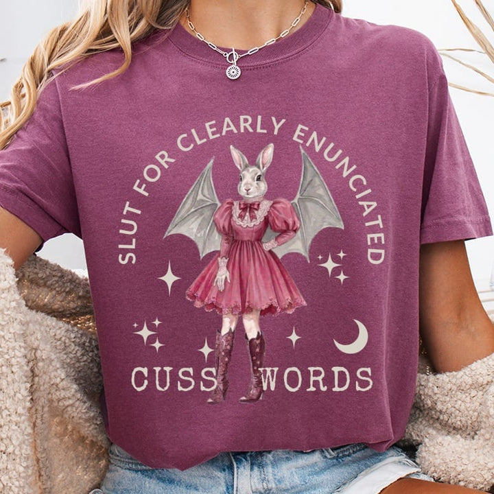 T-shirt with a cartoon bunny in a dress and wings, saying "slut for clearly enunciated cuss words."