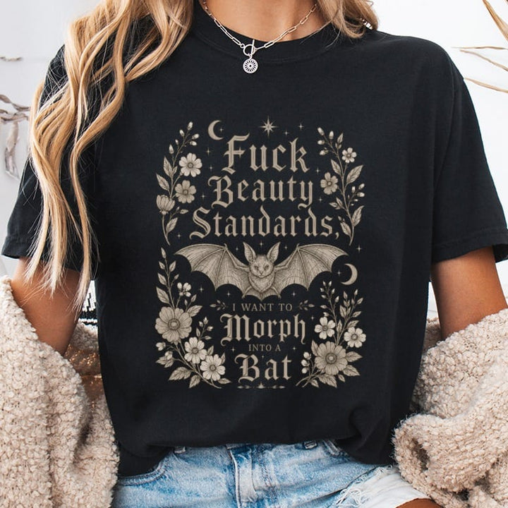 Black t-shirt with a bat and floral design, text reads "Fuck Beauty Standards I Want to Morph Into a Bat".