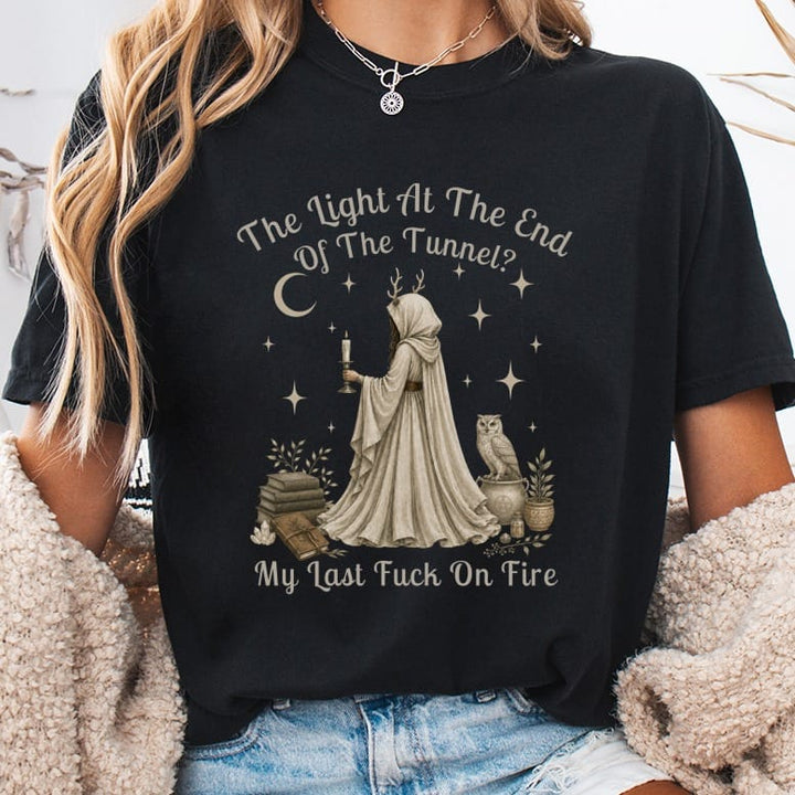 Black t-shirt with graphic: "The Light At The End Of The Tunnel? My Last Fuck On Fire".