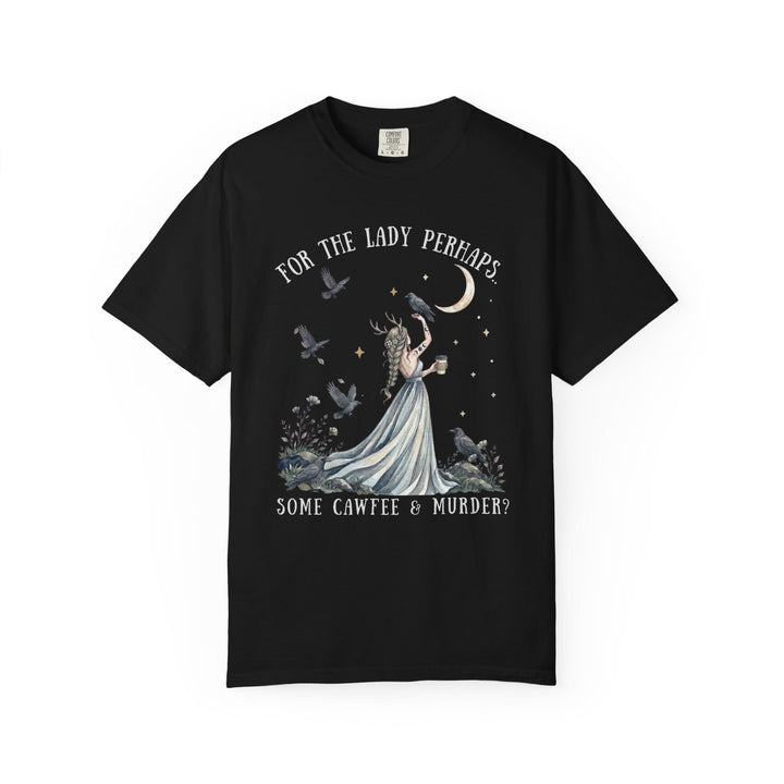 A black t-shirt printed with a graphic featuring a horned woman surrounded by crows, the moon, and text reading "For the lady perhaps... some cawfee & murder?".