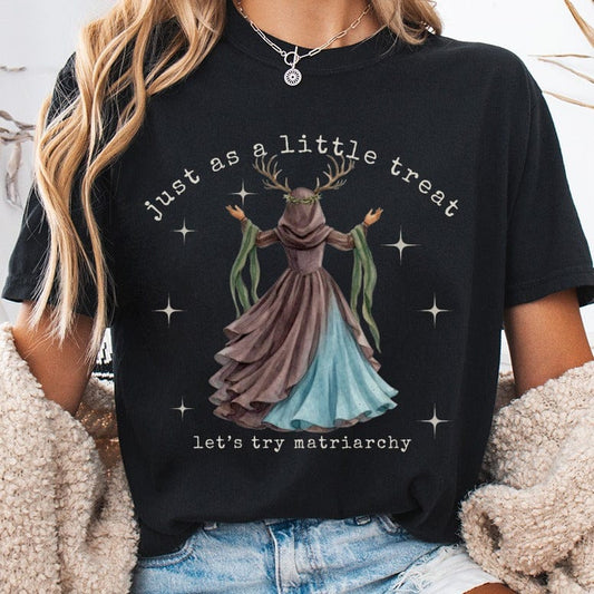Dark t-shirt with graphic of a woman in a gown with antlers and text.
