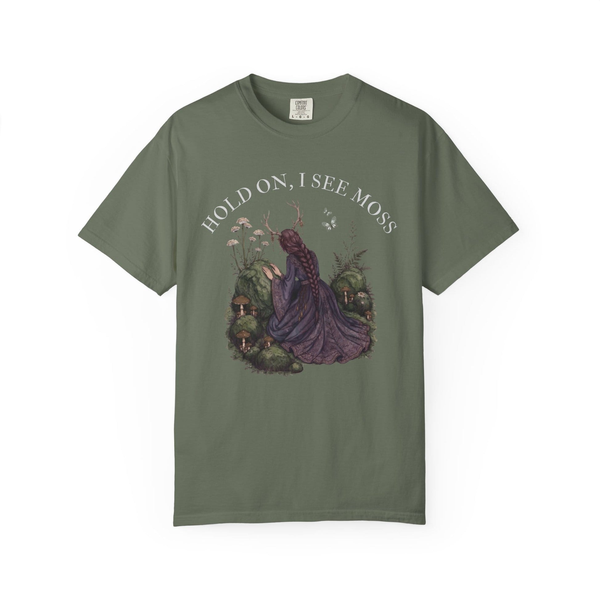 Woman in purple dress with moss and mushrooms, text "HOLD ON, I SEE MOSS".