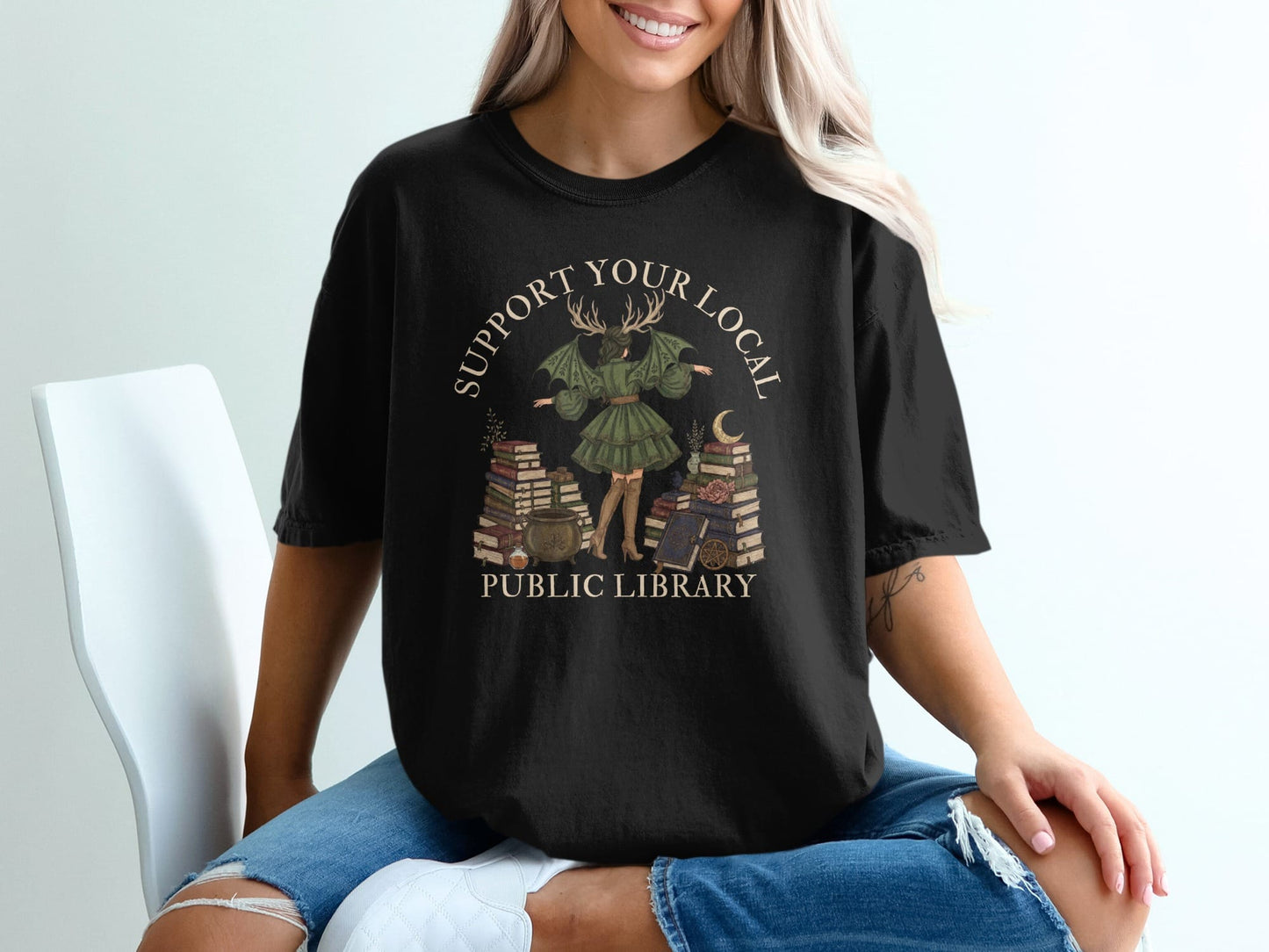 Black t-shirt with "Support Your Local Public Library" and mystical library art.