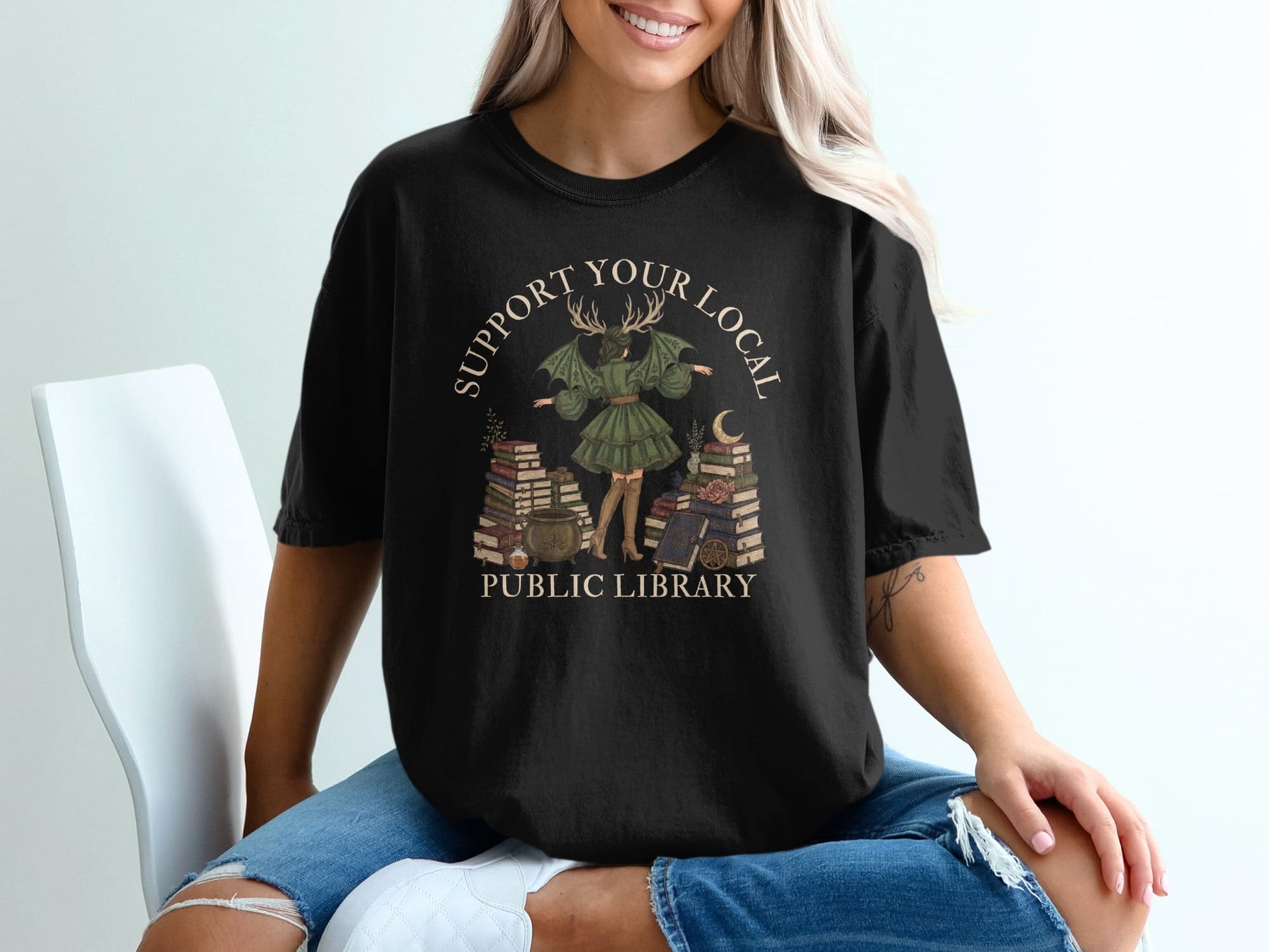 Black t-shirt with "Support Your Local Public Library" and mystical library art.