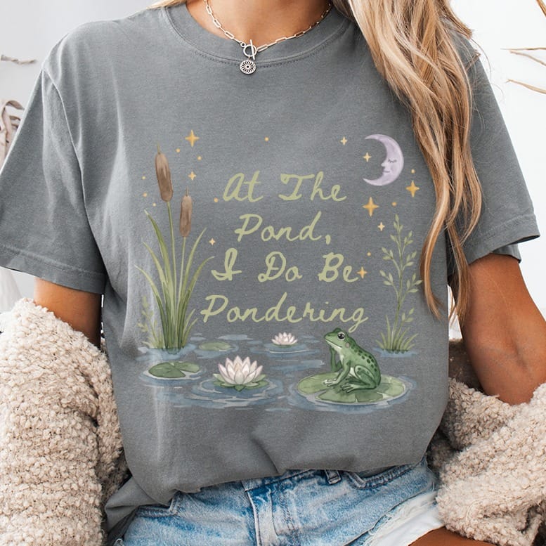 Grey t-shirt with frog, lilies, and text "At The Pond, I Do Be Pondering."
