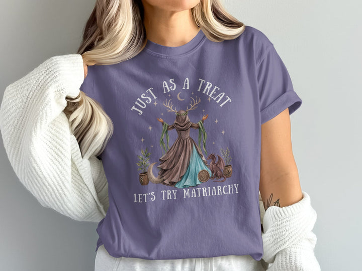Purple t-shirt with "JUST AS A TREAT LET'S TRY MATRIARCHY" text and mystical art.