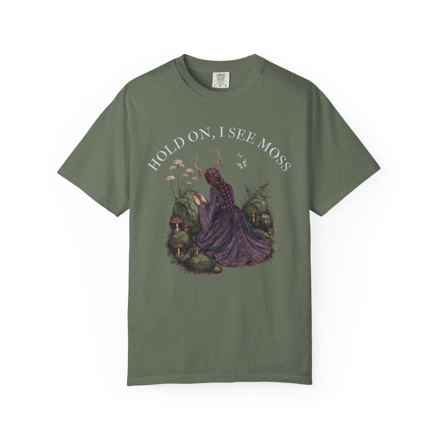 Woman in purple dress kneeling among mossy mushrooms, with text "HOLD ON, I SEE MOSS".