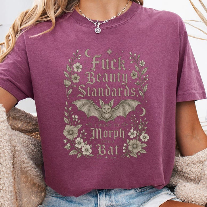 Berry t-shirt with "Fuck Beauty Standards, I Want to Morph Into a Bat" text and bat graphic.