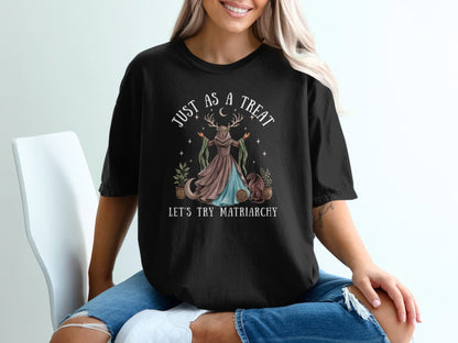 Black t-shirt with "Just As a Treat Let's Try Matriarchy" text and moon goddess graphic.